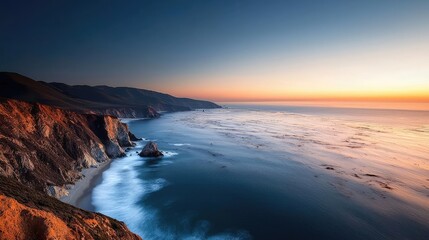 Sunset over the ocean scenic view with vibrant sky and dramatic dusk concept. Stunning coastal landscape at sunset with vibrant colors.