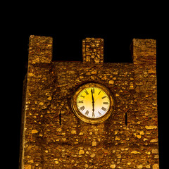 clock tower in golden light at night landscape in old ancient style with clock showing six o'clock