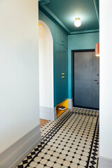 The front door and the hallway. Stylish and elegant interior of the room. Bright yellow accents on...