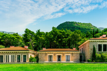 beautiful summer landscape of amazing resort on amazing island with yellow ancient walls and orange tile roofs among sea vawes and nice blue sky on background