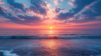 Obraz premium Sunset over the ocean scenic view with vibrant sky and dramatic dusk concept. A breathtaking sunset over tranquil ocean waters.