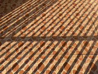 Floor photo background with brown speckled pattern and line shadows
