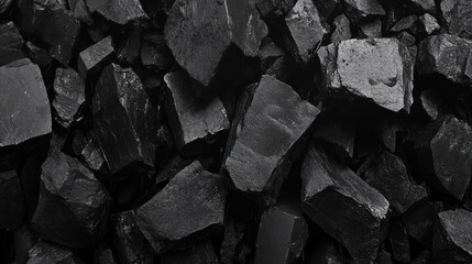 Dark Monochromatic Stones: A Textured Abstract Image of Black Rock Fragments