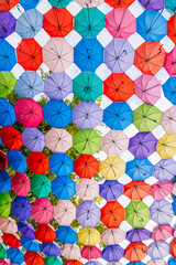 Fototapeta na wymiar multicolored bright colorful umbrellas decoration on festive rainbow street in Tashkent in Uzbekistan