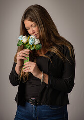 Smelling a bouquet of roses