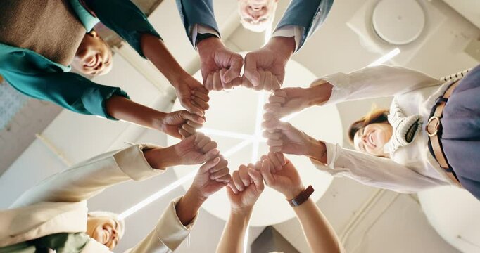 Business, people and hands with fist bump in circle for company team building, solidarity and collaboration. Low angle, employees and happy with workplace integration, synergy and support in office