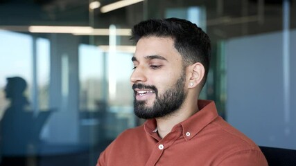Close up of a handsome businessman relaxing with his eyes closed sitting in the office. Calm happy entrepreneur resting in break at work breathing deeply, feels peace of mind. Male relaxes to relieve 
