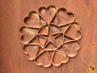 An ornate metal door featuring a flower pattern