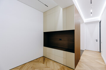 A modern minimalist interior design that features elegant wooden finishes for a stylish look