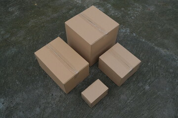 Photo of a pile of brown cardboard boxes