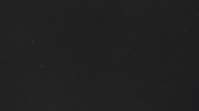 Time lapse of rotating stars and perseids on a dark sky