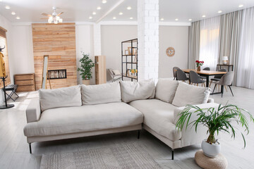 Modern living room interior with comfortable sofa and wooden table