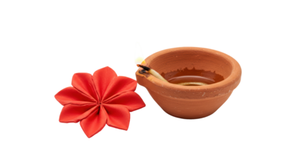 Isolated Clay Lamp and Red Flower