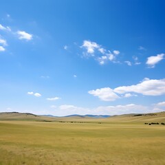 Fototapeta premium Spokojny krajobraz pod ogromnym błękitnym niebem