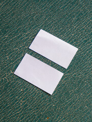 Plain business card mockup on the peeled leather sofa