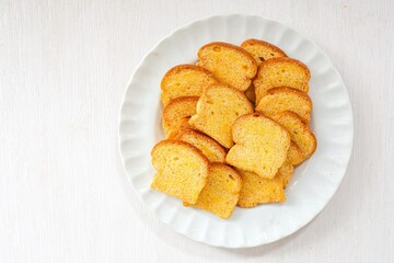 Crispy Bread Butter Sugar in white plate on white background,Biscuits