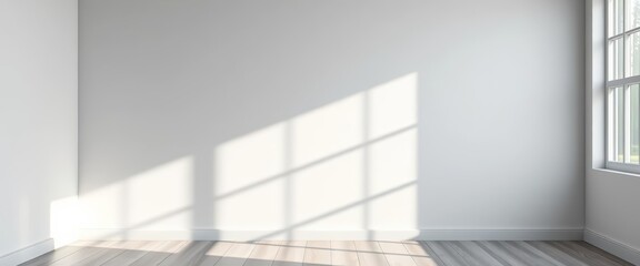 Fototapeta premium Subtle grey backdrop, soft window light and shadow play on wall, ample empty space, simple, elegant