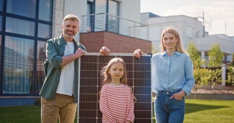 Husband and wife talking about importance of green energy. Man and woman standing with solar panel....