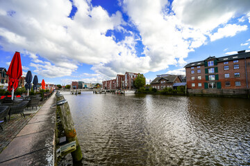Obraz premium View of the Husumer Au in Husum on the North Frisian North Sea coast. The old town with historic buildings. 
