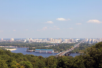 Aerial view of a city with a river and bridge