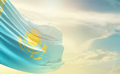 Kazakhstan flag wave in soft clouds. National flag beautifully waving in the sky. Kazakhstan national flag for independence day.