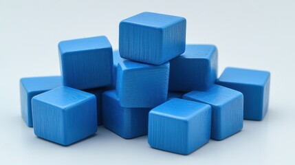 Stack of blue wooden cubes on white background.