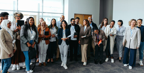 Group of professionals smiling and laughing during a business meeting
