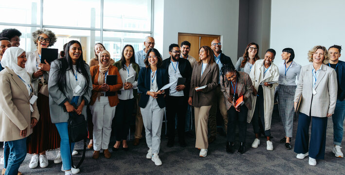 Group of professionals smiling and laughing during a business meeting