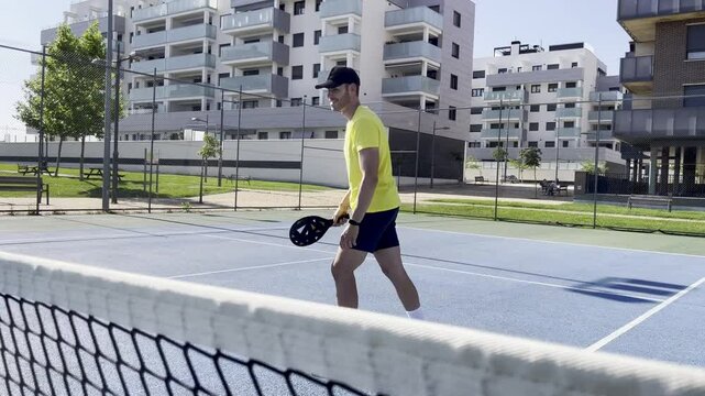 Enthusiastic pickleball player competing on outdoor court