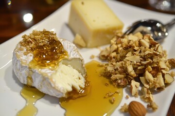 Nut-Crusted Cheese Platter A gourmet cheese platter with nuts and honey drizzled over a soft brie