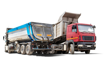 Heavy construction trucks are parked in an isolated rental yard, ready for transporting materials....