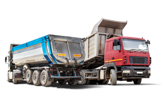 Heavy construction trucks are parked in an isolated rental yard, ready for transporting materials. These vehicles play a crucial role in construction projects.