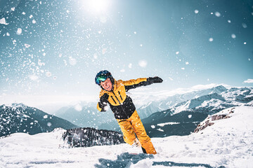 Photo of a boy jumping an plaing on snow on Spinale