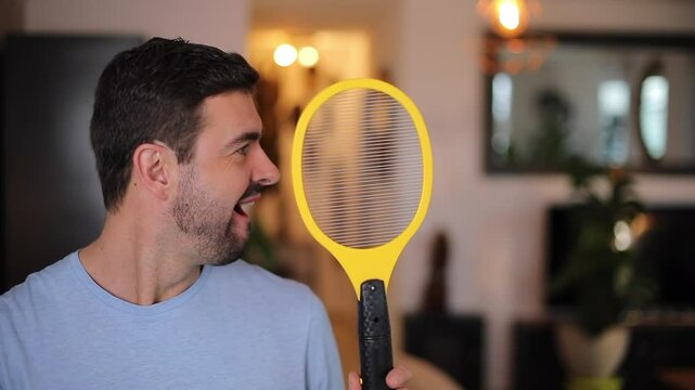 Man hunting insects with an electric tool 