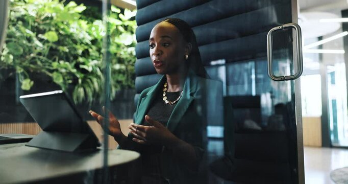 Video call, office and business black woman on laptop in cubicle for private meeting, discussion or virtual chat. Corporate, workspace pod and person on computer for talking, communication or webinar