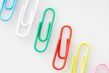 Macro Shot of Colorful Paper Clips Showcasing Vibrant Texture and Detail on White and Isolated Background