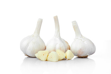 Close up Texture of Fresh Garlic Bulbs and Cloves on White and Isolated Background