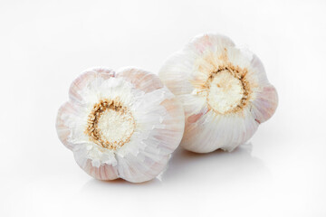 Close up Macro Shot of Garlic Bulbs Showcasing Texture and Details of the Earthy Produce on White and Isolated Background
