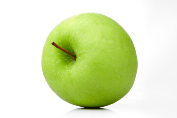 Close up Macro Shot Showcasing Texture of a Fresh Green Apple With Stem on a White Background