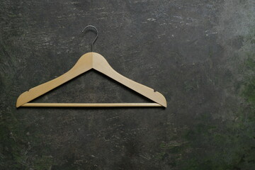 Photo of a wooden clothes hanger on the floor