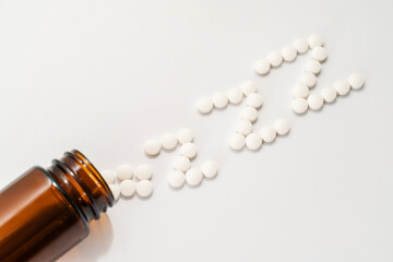 insomnia concept. sleeping pills in the form of z-z-z are scattered from a die