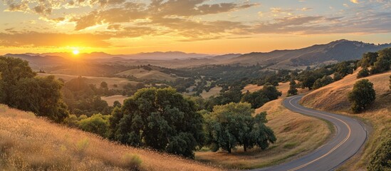 A beautiful landscape shows a winding road at sunset time