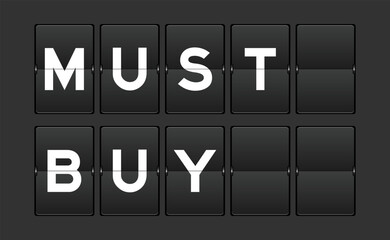 Black color analog flip board with word must buy on gray background