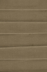 Fototapeta premium High-resolution texture of brown kraft paper with horizontal fold lines. The paper has a natural, recycled appearance and a slightly rough surface. 