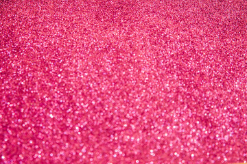 A soft pink bokeh-style background with unfocused light creates an elegant space for text or design elements.