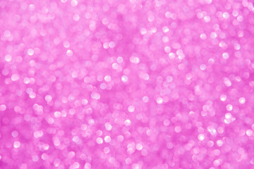 A soft pink bokeh-style background with unfocused light creates an elegant space for text or design elements.