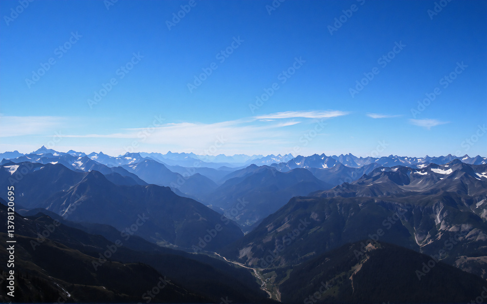 Poster a vast mountain range stretches under a clear blue sky, with visible peaks and valleys creating a sc