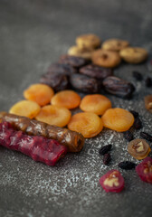 Composition of dried fruits dates, figs, apricots, churchkhela