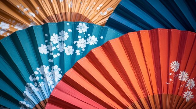 Colorful asian paper fans display with floral patterns