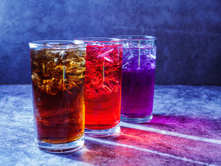 A lot of Soft drinks in colorful and flavorful glasses on the table,Glasses with sweet drinks with...